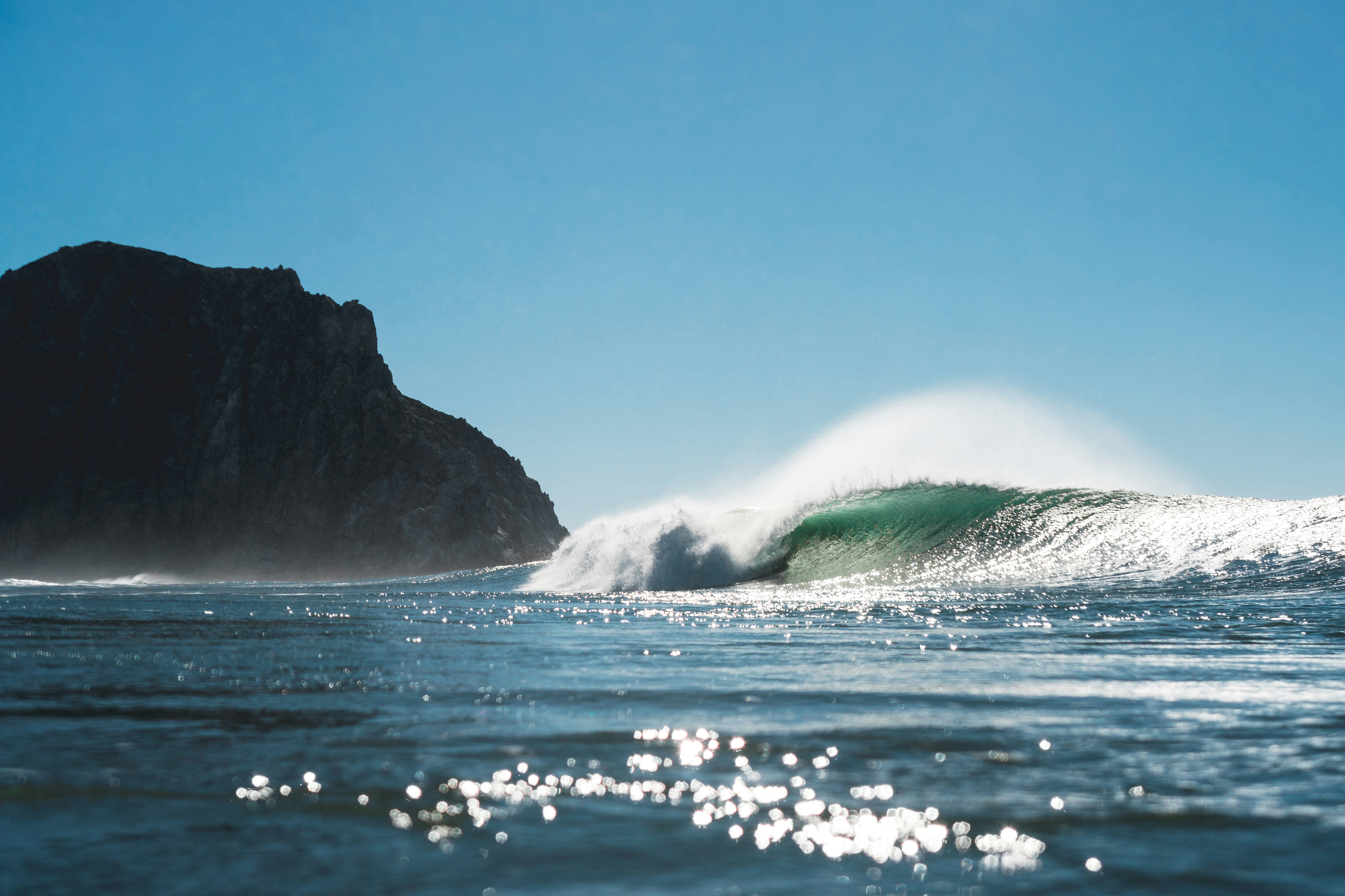 a large wave is coming towards the shore.
